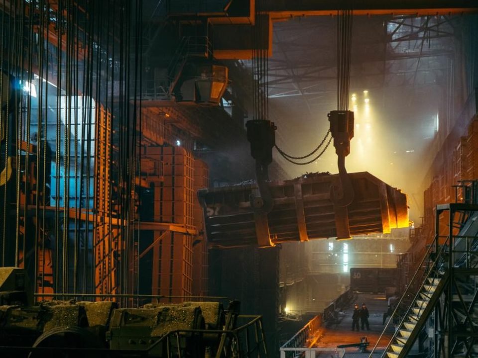Molten metal being poured in a steel foundry